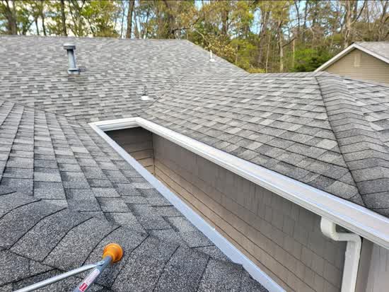 Gutter guard system protecting home