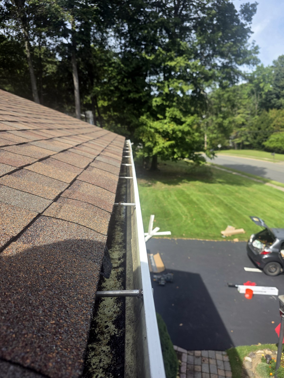 Before gutter guard installation: open gutter on a local home