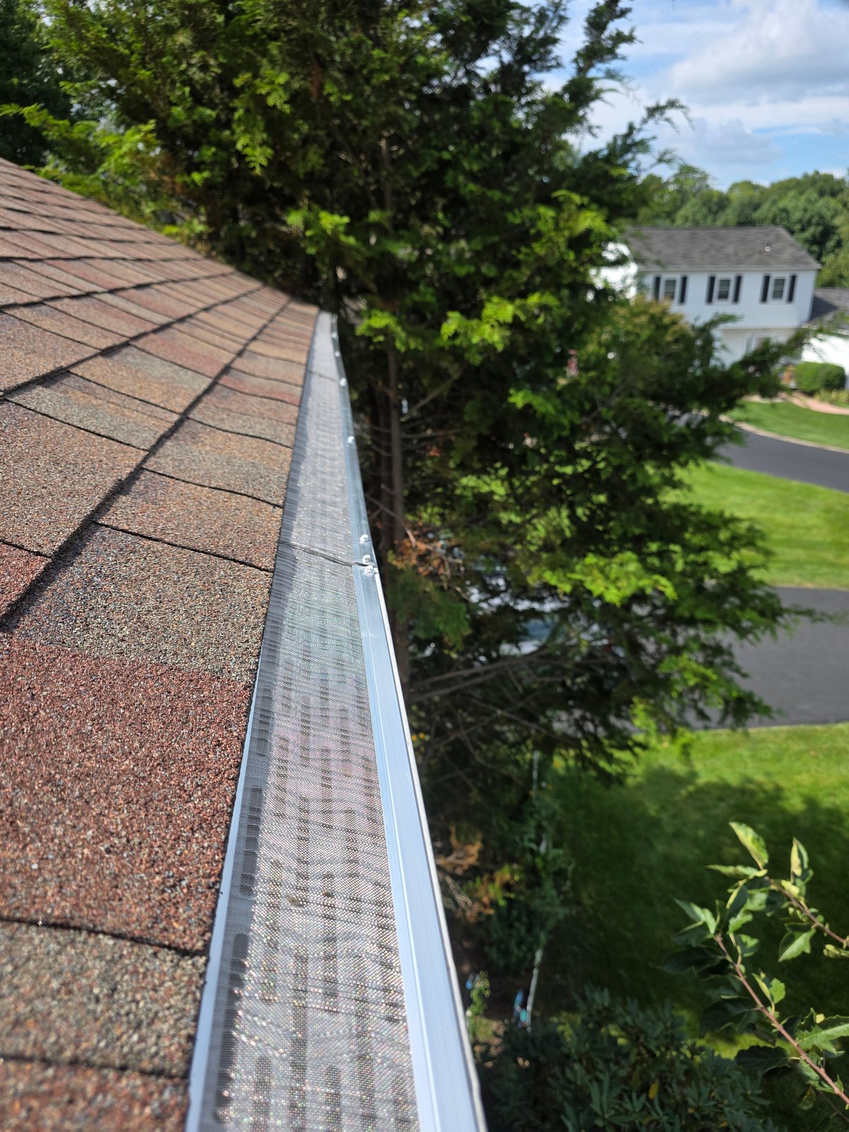 Completed micro mesh gutter guard run on a local home