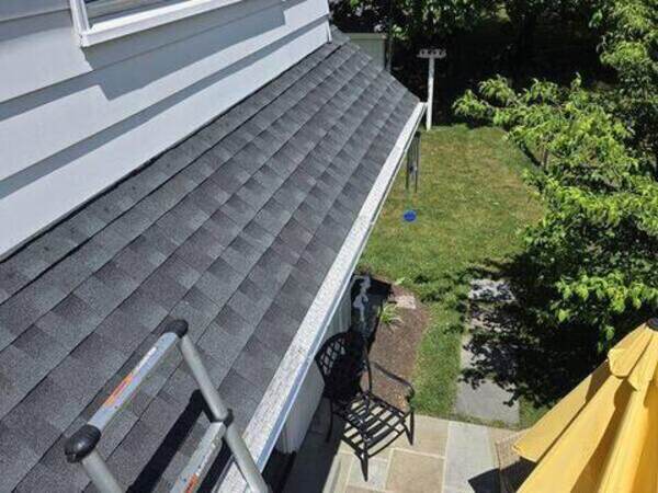 Gutter guard installation in progress on a local home